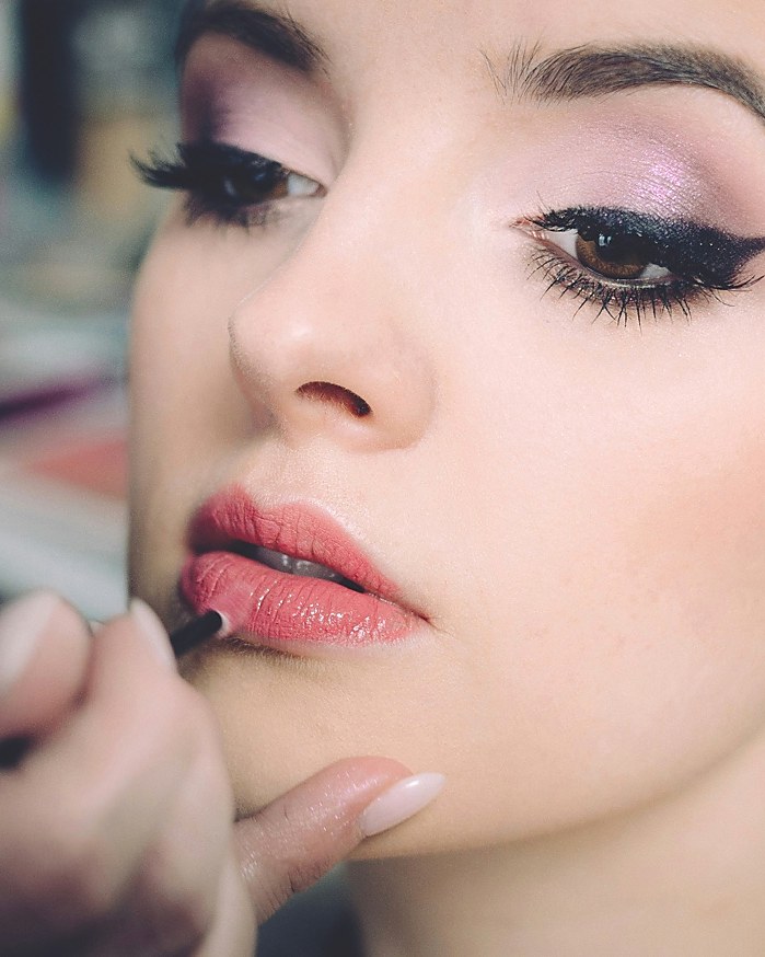 Close-up of soft glam makeup application